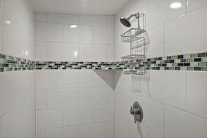 Bathroom view of a tile shower