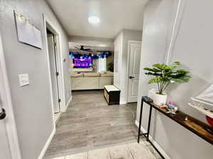 Mudroom with ceiling fan and light wood-type flooring