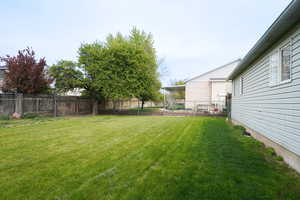 View of fenced backyard