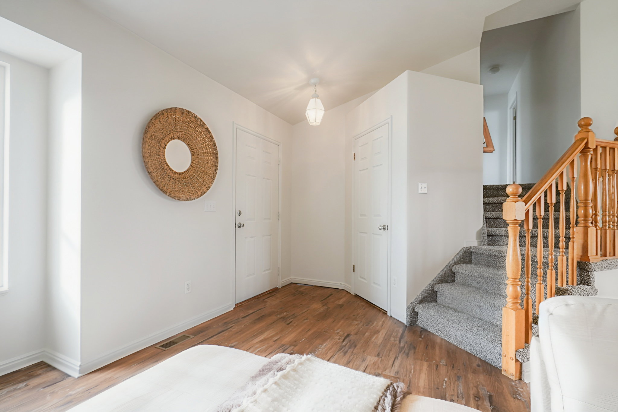 Entrance foyer featuring light wood finished floors