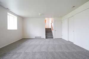 Interior space with stairs and carpet floors