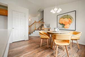 Dining room featuring light wood-type flooring and hanging lights