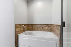 Primary Bathroom featuring a separate tub/shower