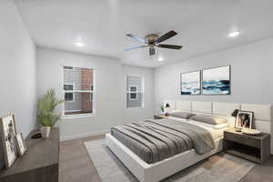 Carpeted bedroom featuring baseboards and ceiling fan