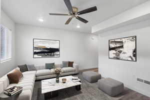 Living area with a ceiling fan, wood finished floors, and recessed lighting