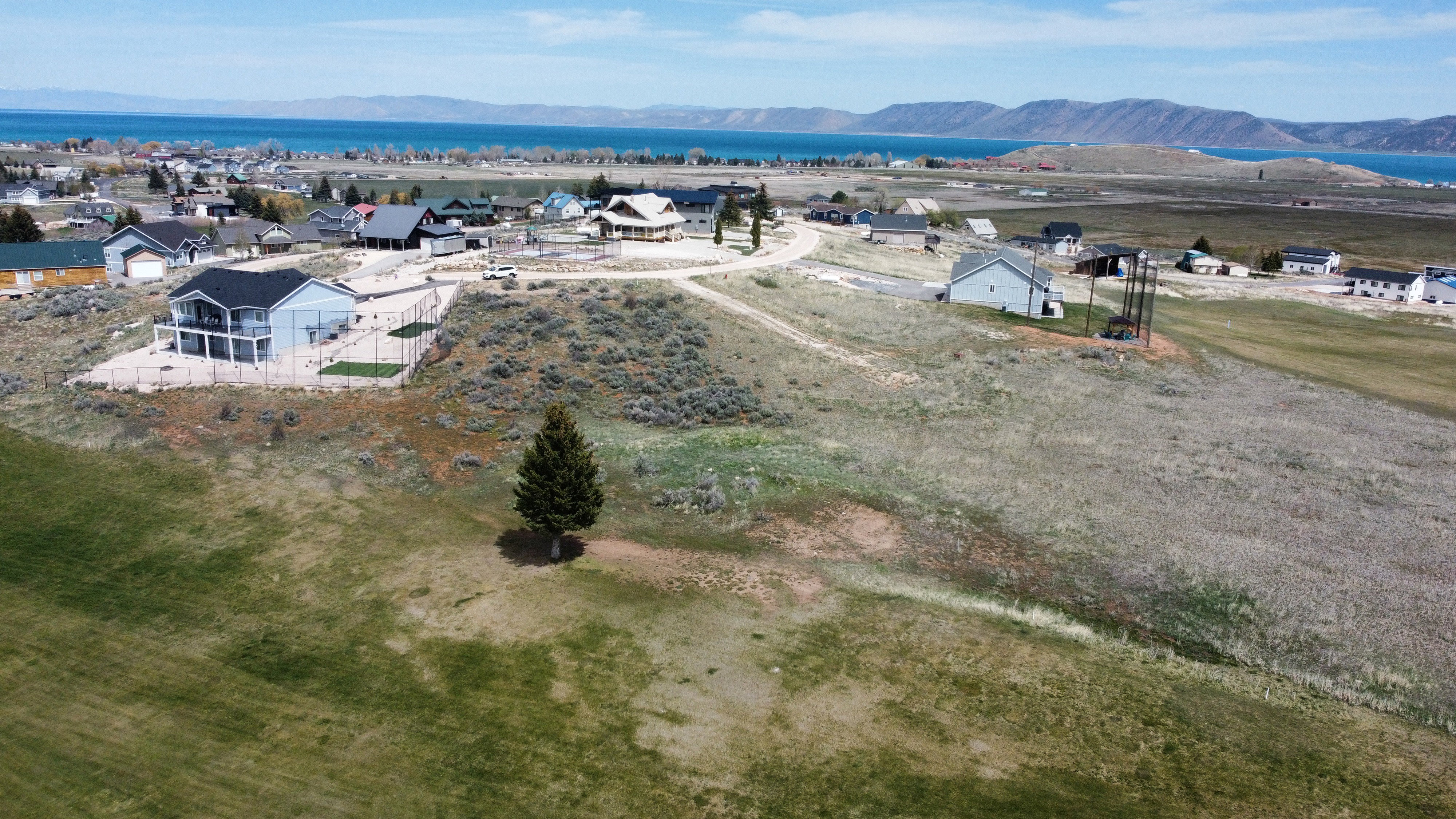 Aerial view of residential area featuring a mountain backdrop