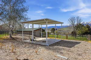 View of patio / terrace with a mountain view and a view of countryside