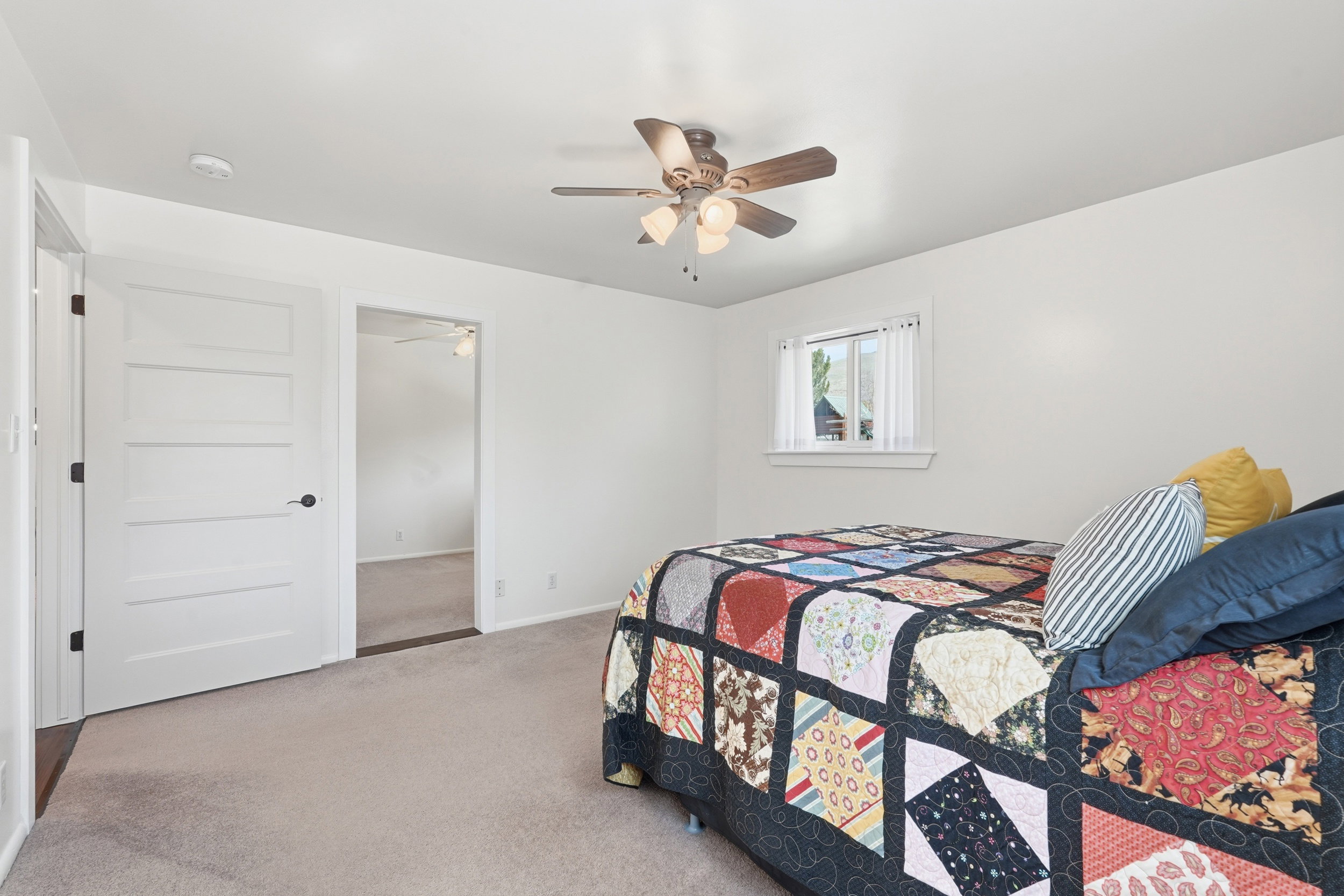 Bedroom with carpet and ceiling fan