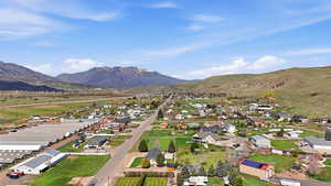 Aerial view of residential area featuring a mountain backdrop