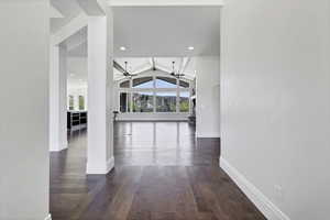 Corridor featuring beamed ceiling, dark wood-style flooring, and recessed lighting