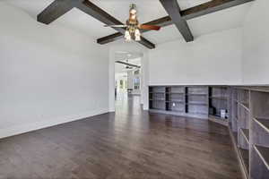 Unfurnished room featuring dark wood-style flooring, coffered ceiling, and ceiling fan