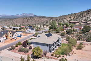 Aerial perspective of suburban area featuring a mountain backdrop