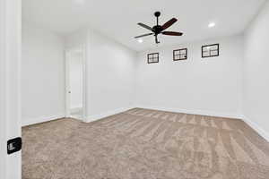 Spare room with recessed lighting, light carpet, and ceiling fan
