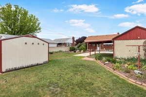 View of yard with a storage shed
