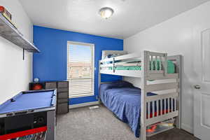 Comfortable bedroom with natural light, neutral finishes, and flexible space for a variety of uses.