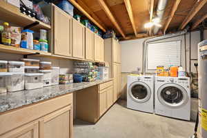 This isn’t just a laundry room—it’s a behind-the-scenes workhorse. Generous counter space makes folding feel less like a chore and more like a system, while abundant cabinetry keeps everything organized and out of sight. The added storage creates th