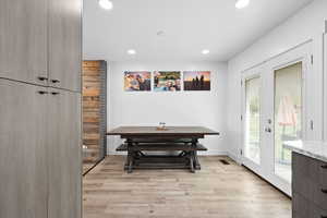 Spacious dining area with updated flooring and direct access to the backyard—perfect for everyday living and entertaining.