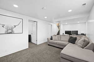 Spacious lower-level retreat with a versatile layout—perfect for gathering, working, or creating a space that fits your lifestyle.