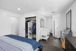 Comfortable primary suite with open closet organization and a private bath designed for easy, everyday living.