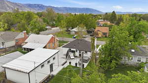 Aerial perspective of suburban area with a mountainous background