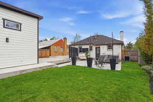 Back of house with a patio and a fenced backyard