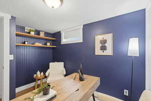 Office space featuring a textured ceiling and wood finished floors