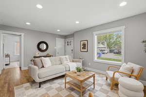 Living room featuring recessed lighting and light wood-style flooring