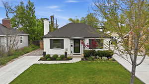 View of front of home with brick siding and driveway