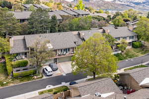 Aerial perspective of suburban area featuring a mountain backdrop