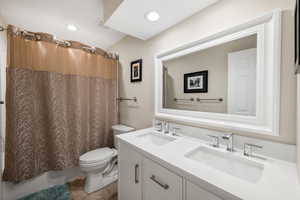 Full bath with double vanity and shower / tub combo