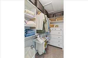 Walk in closet with attic access
