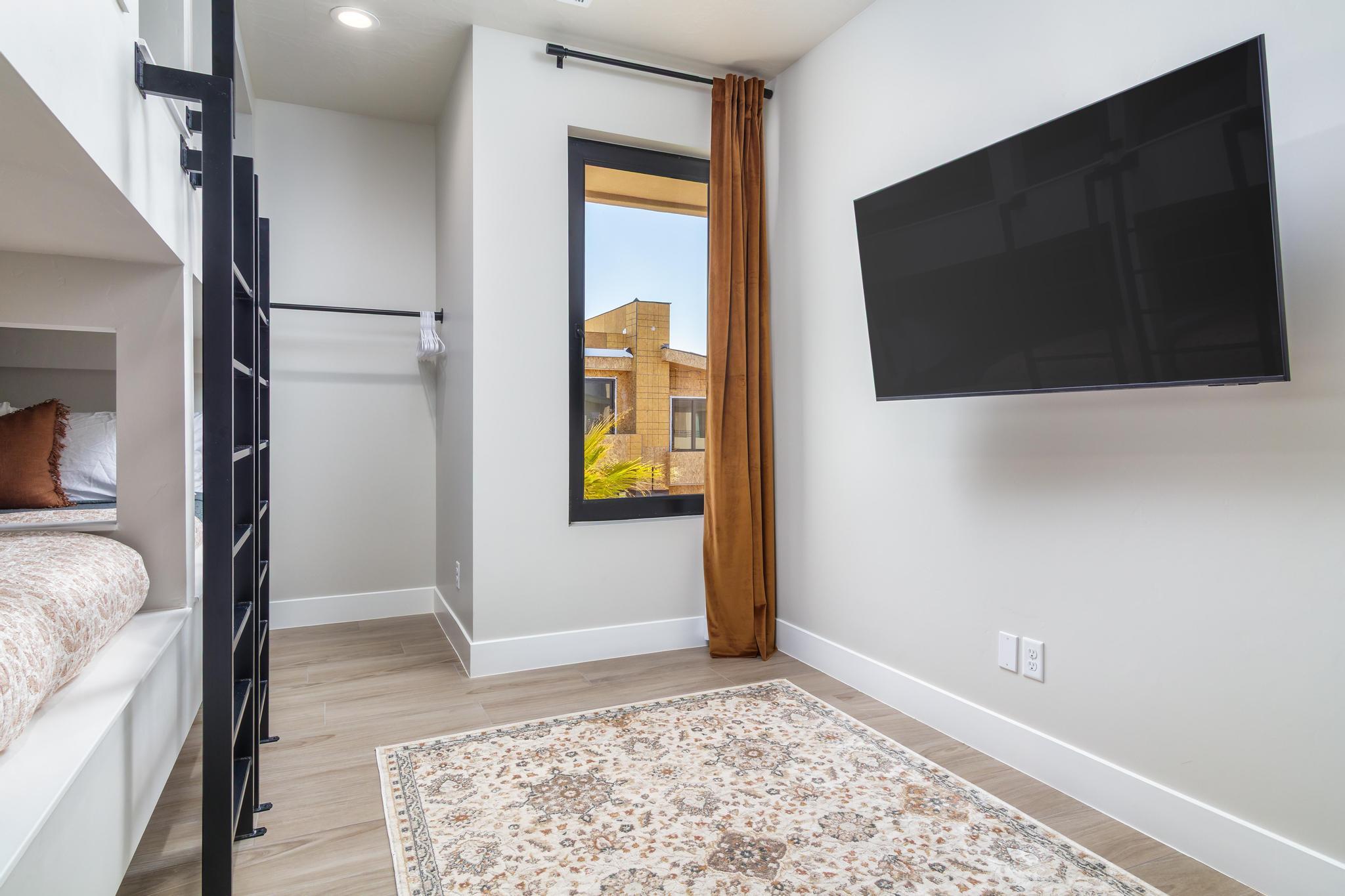 Bedroom with baseboards and light wood-style flooring