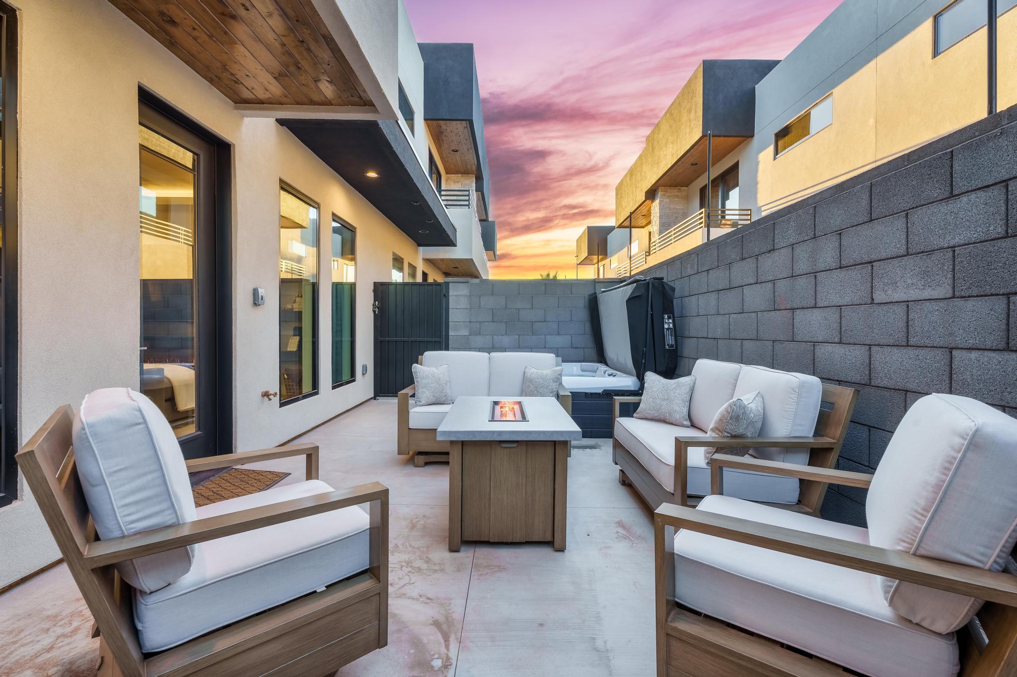 View of patio featuring an outdoor living space with a fire pit