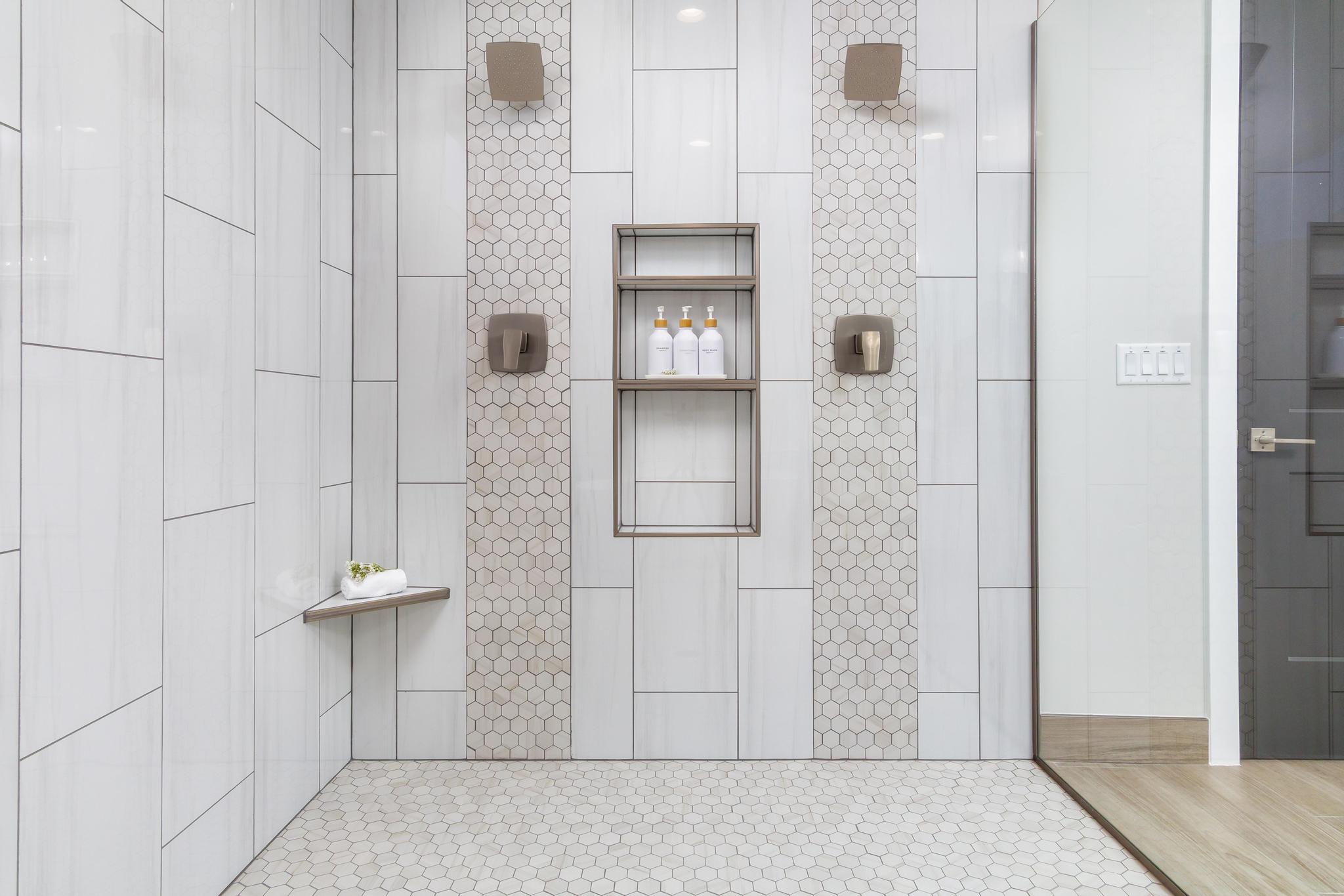 Full bath featuring a tile shower