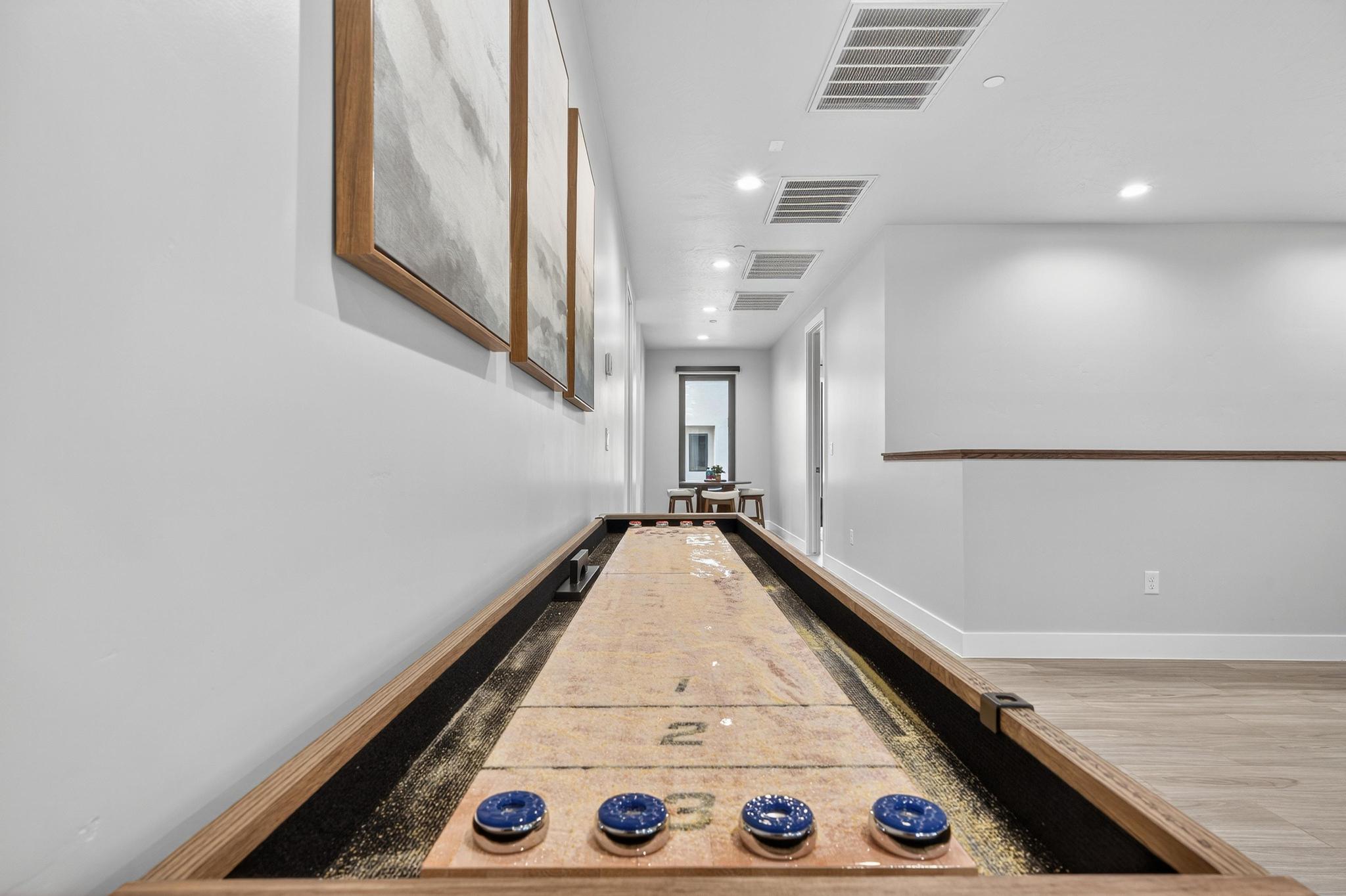 Hallway featuring recessed lighting and wood finished floors