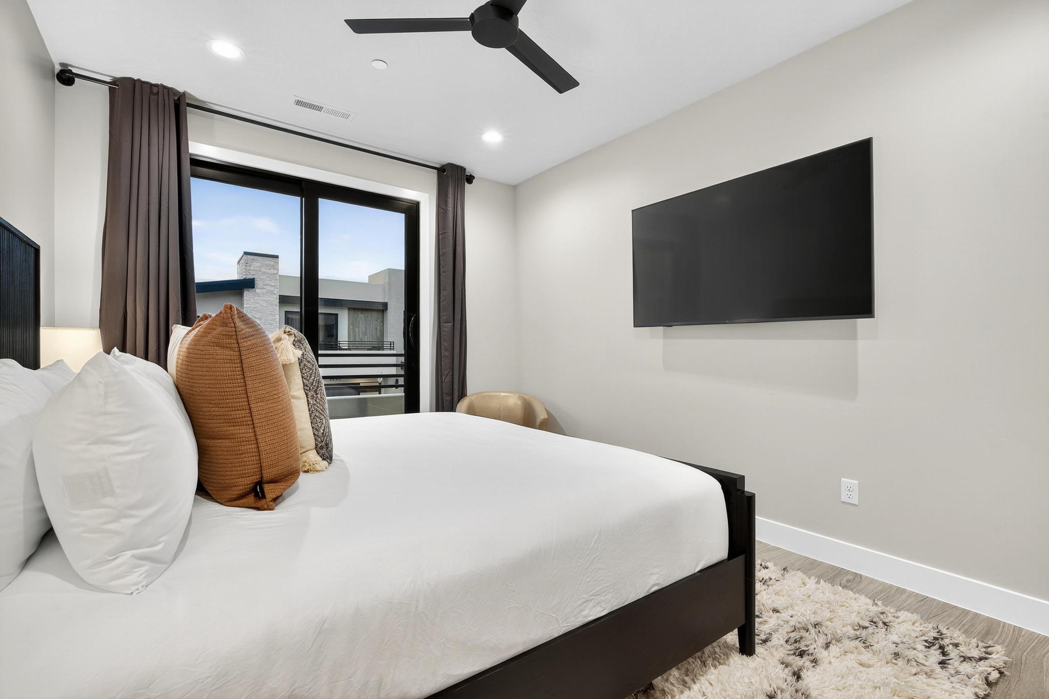 Bedroom with wood finished floors, ceiling fan, and recessed lighting