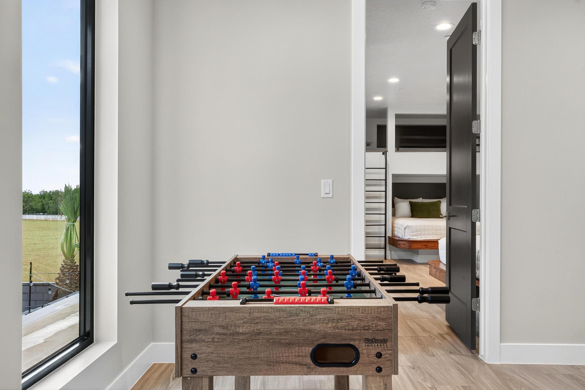 Recreation room featuring light wood-style floors and recessed lighting