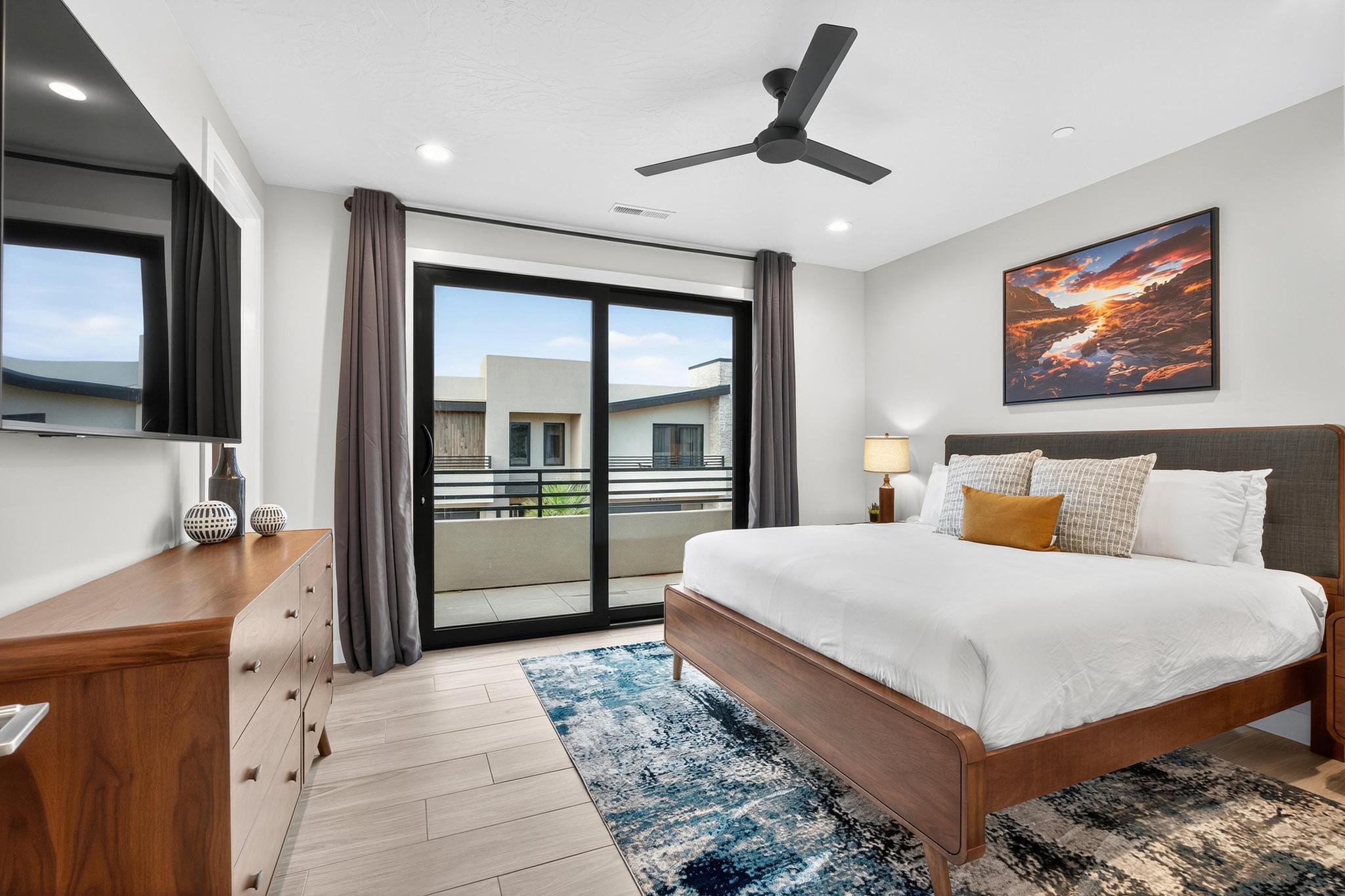 Bedroom with access to exterior, light wood-type flooring, a ceiling fan, and recessed lighting