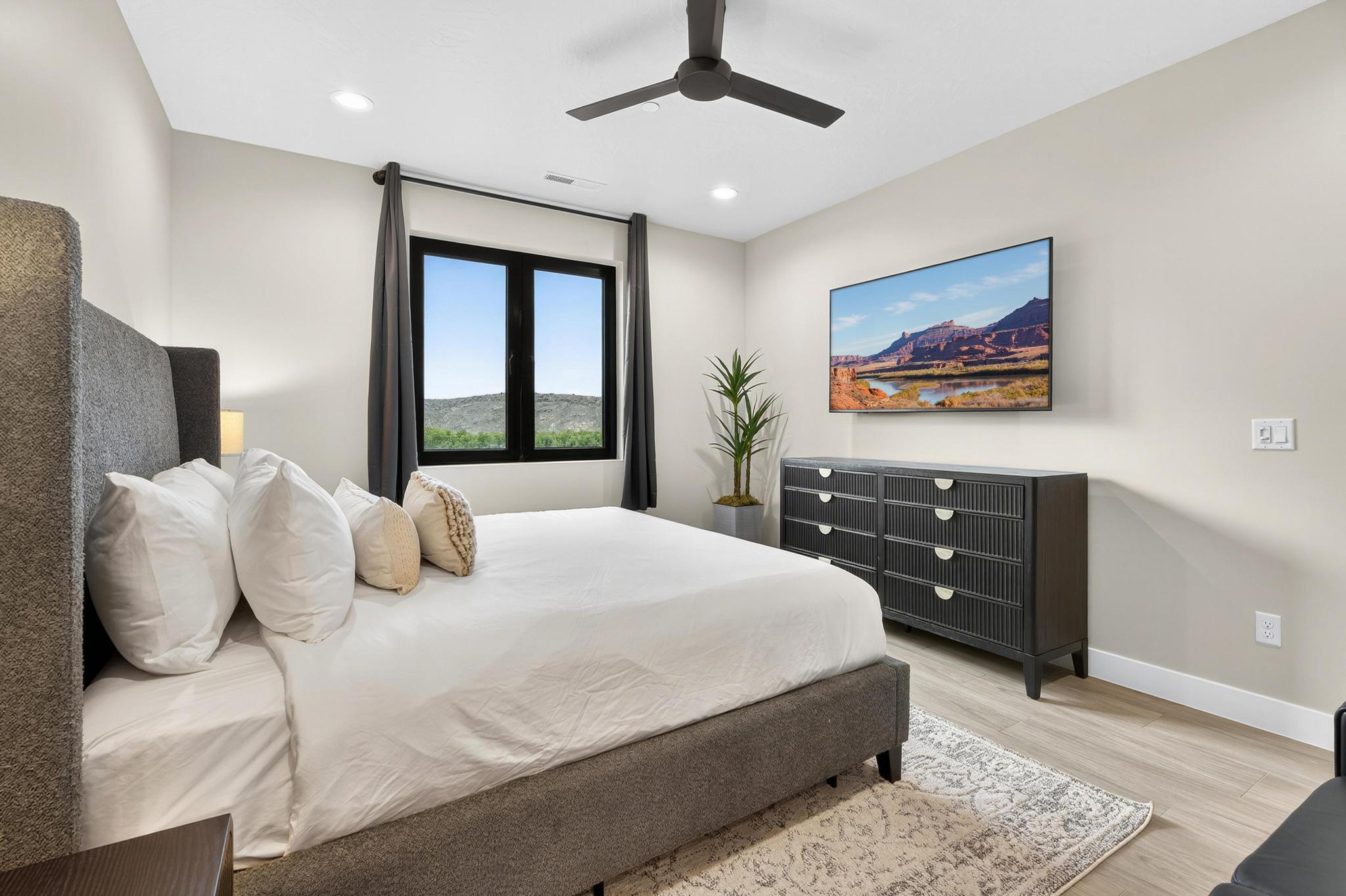Bedroom with light wood finished floors, a ceiling fan, and recessed lighting