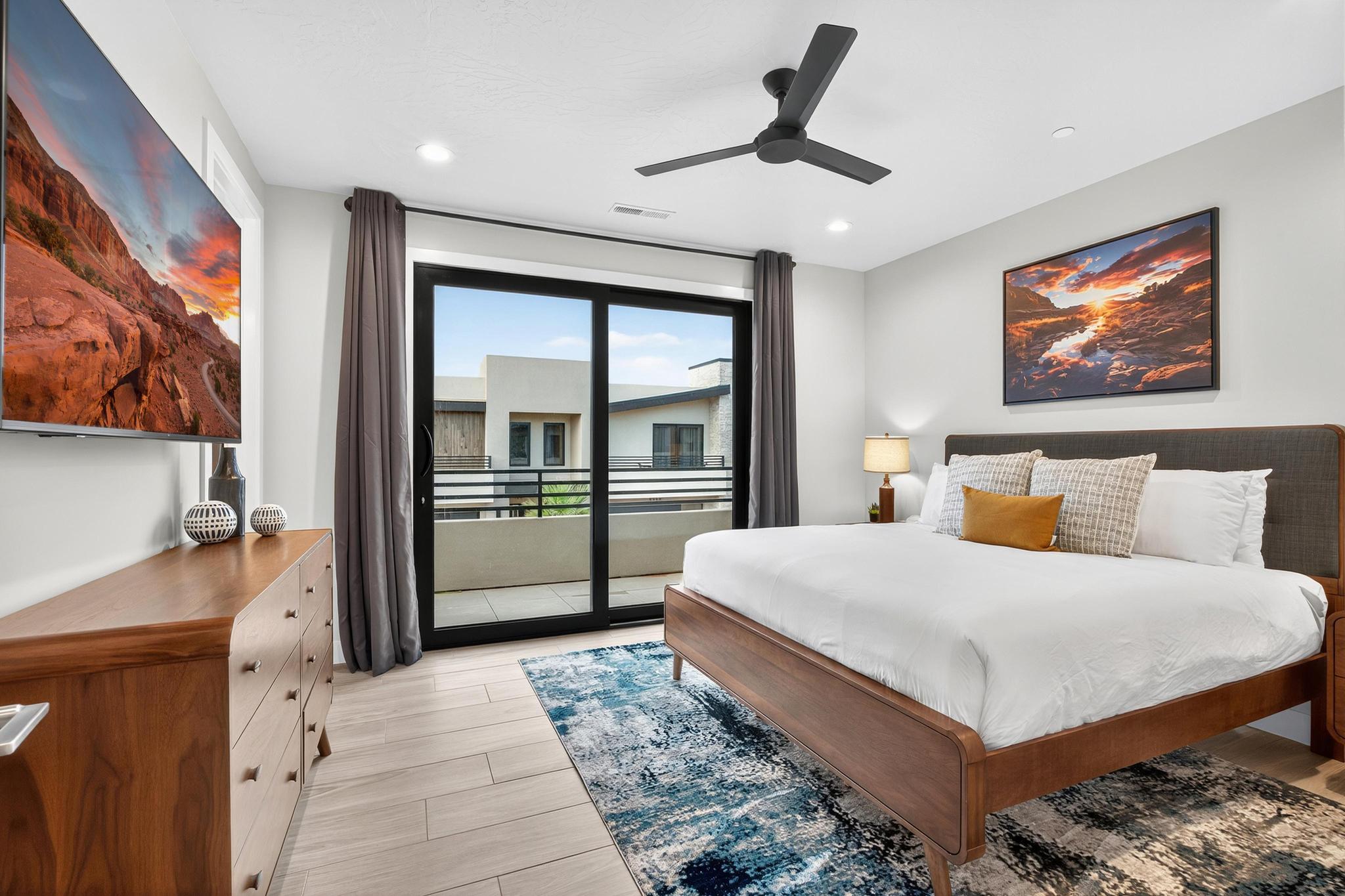 Bedroom with access to exterior, light wood finished floors, a ceiling fan, and recessed lighting