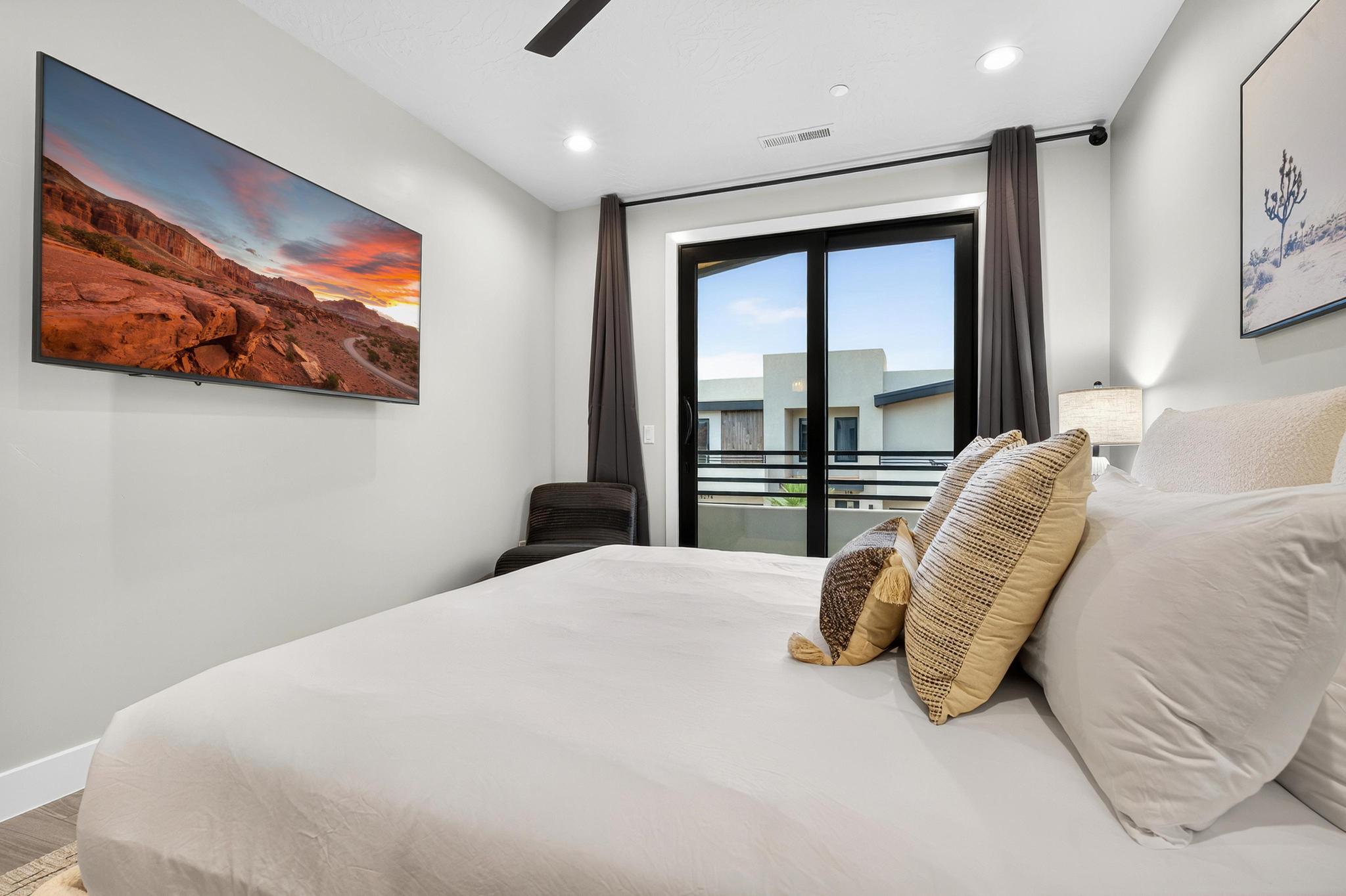 Bedroom with access to exterior, a ceiling fan, and recessed lighting