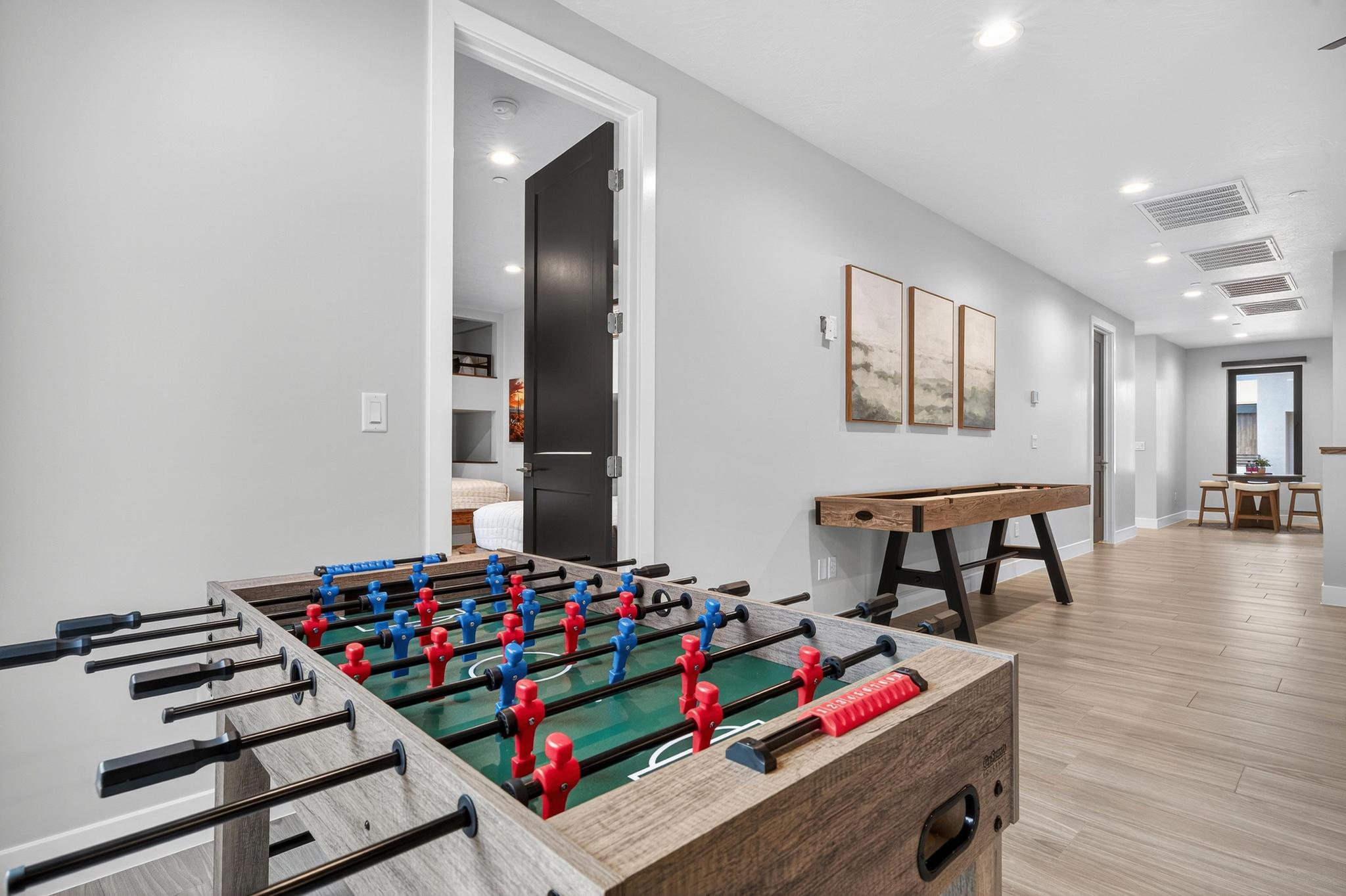 Game room with recessed lighting and light wood-style flooring