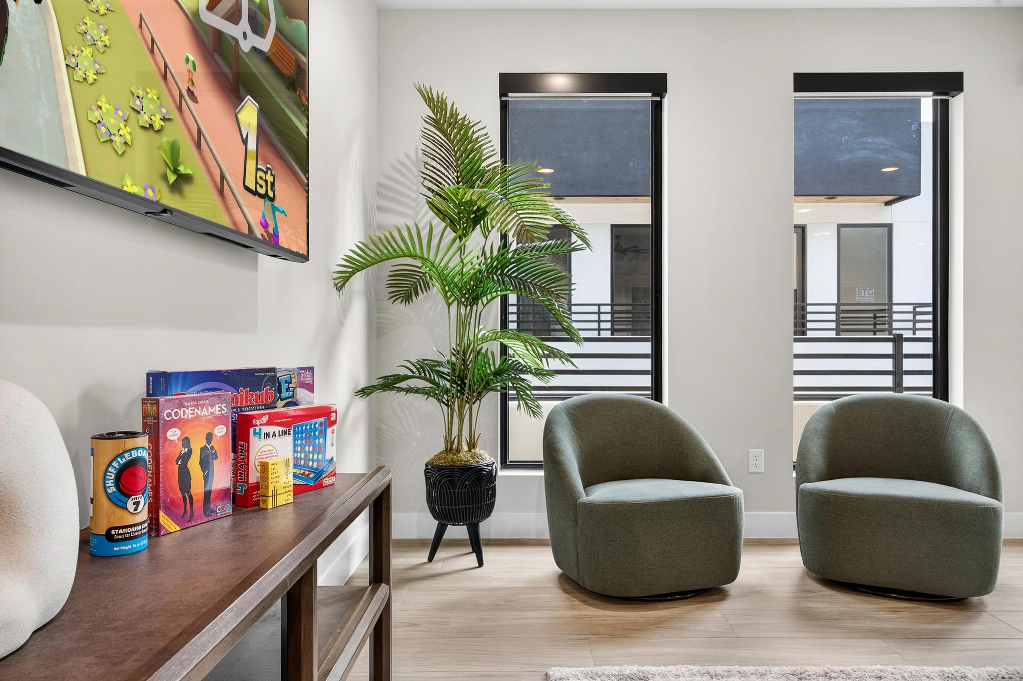 Sitting room featuring wood finished floors and baseboards