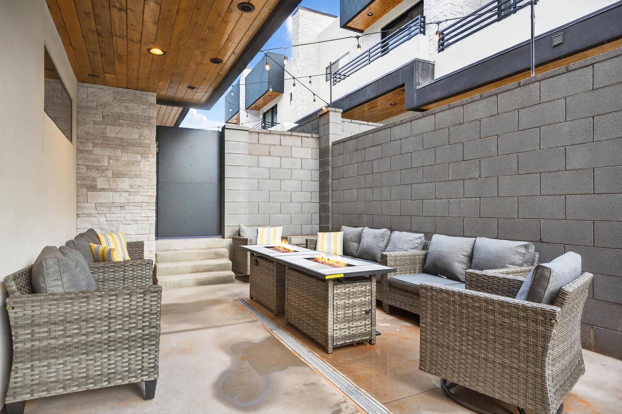 View of patio with an outdoor living space with a fire pit