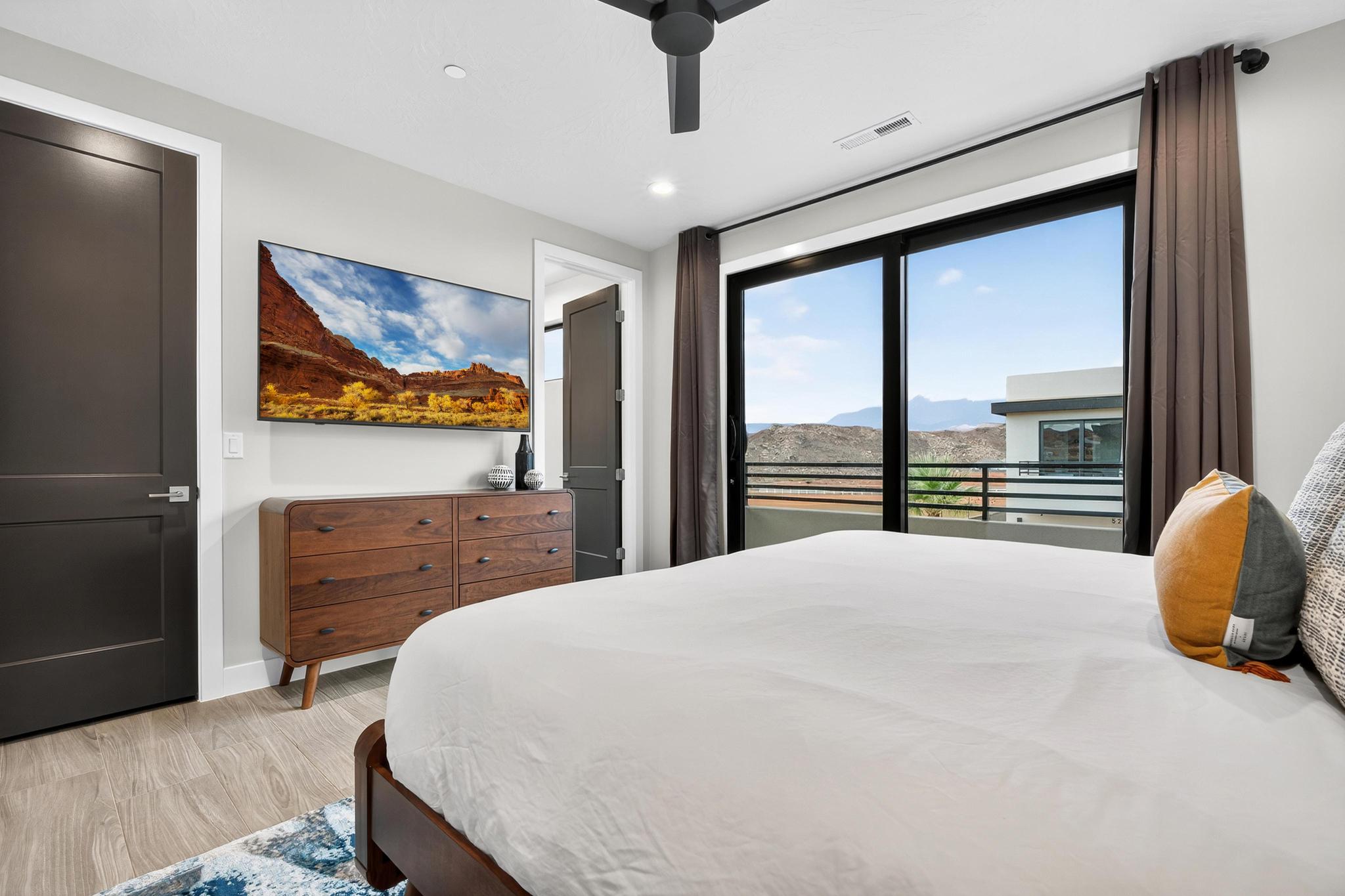 Bedroom featuring access to exterior, light wood-style floors, ceiling fan, and recessed lighting