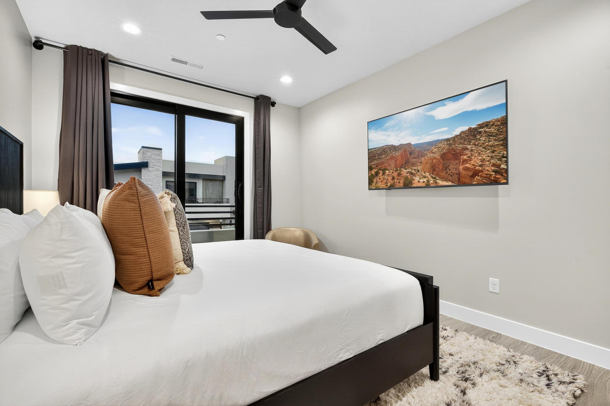 Bedroom featuring wood finished floors, a ceiling fan, and recessed lighting