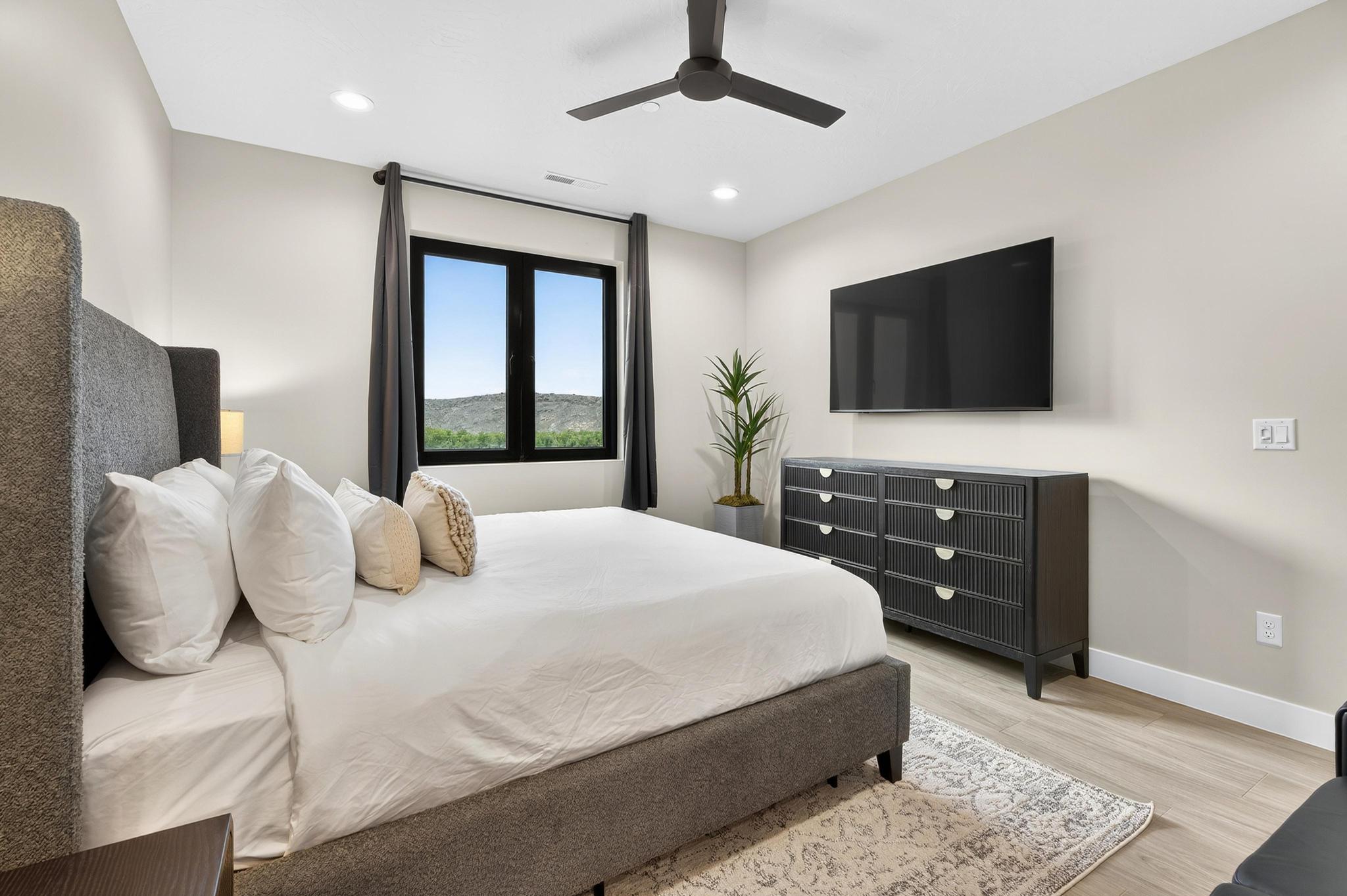 Bedroom featuring light wood-style flooring, ceiling fan, and recessed lighting