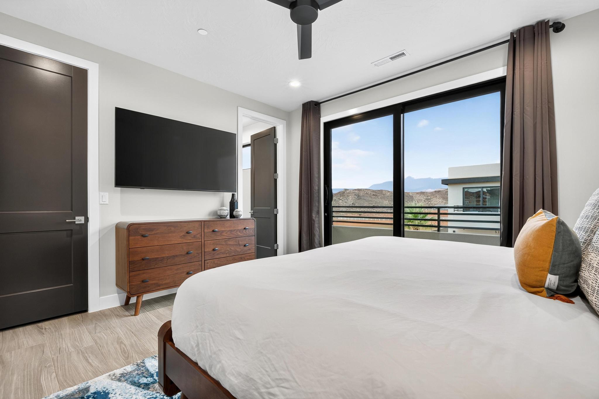 Bedroom with access to exterior, light wood finished floors, a ceiling fan, and recessed lighting