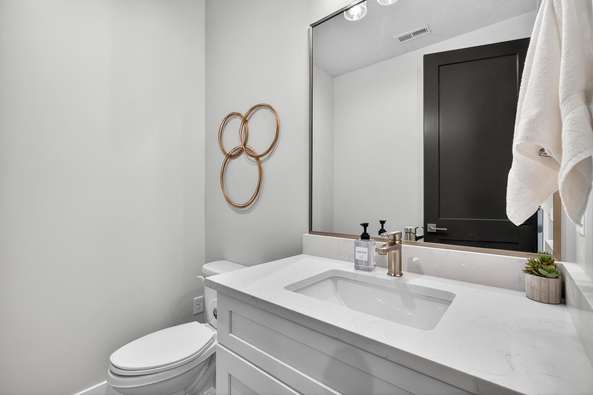 Bathroom featuring vanity and toilet