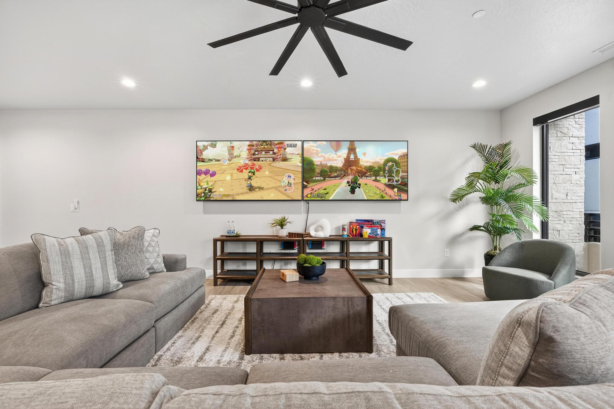 Living area with ceiling fan, light wood-type flooring, and recessed lighting